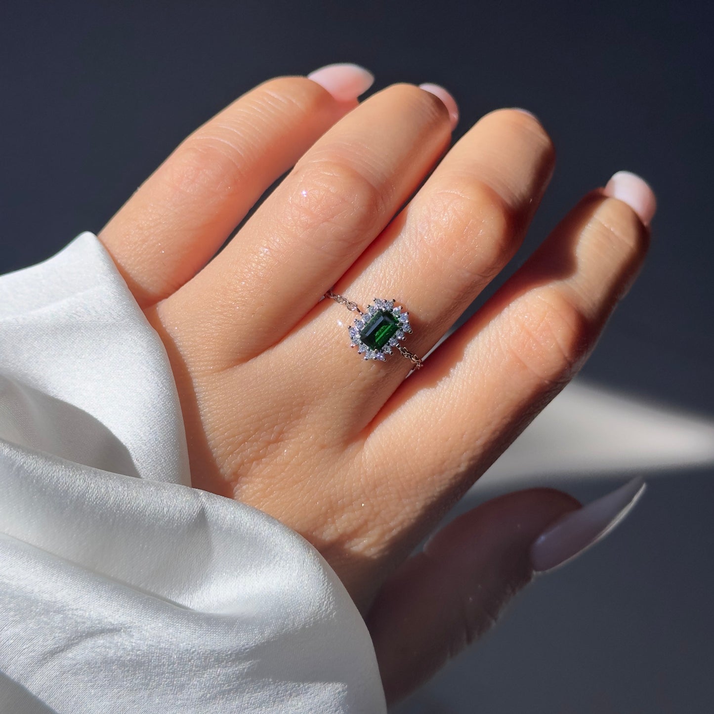 Adjustable vintage halo chain ring with emerald-cut stone