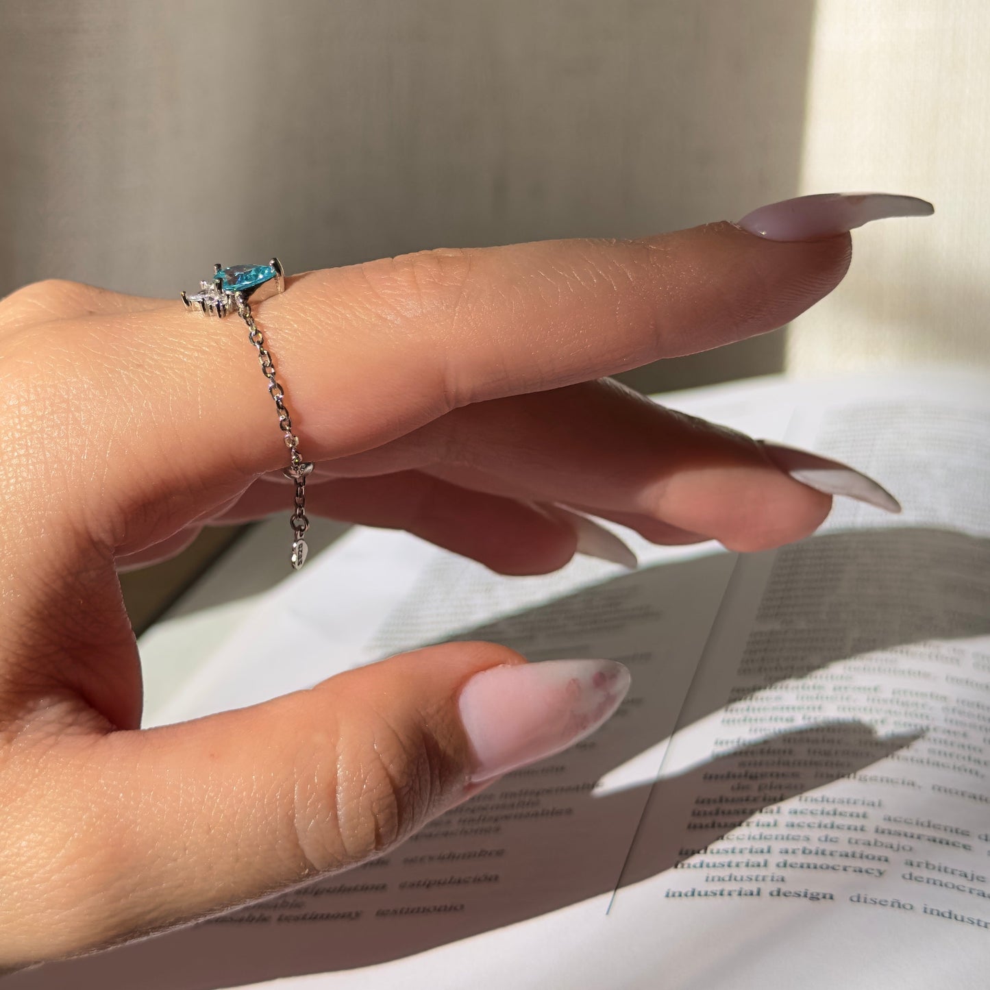 Close-up of aquamarine zirconia on Aquamarine Self-Love chain ring