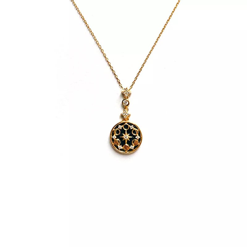 Moon Phase Necklace photographed in low light – astrology vibe