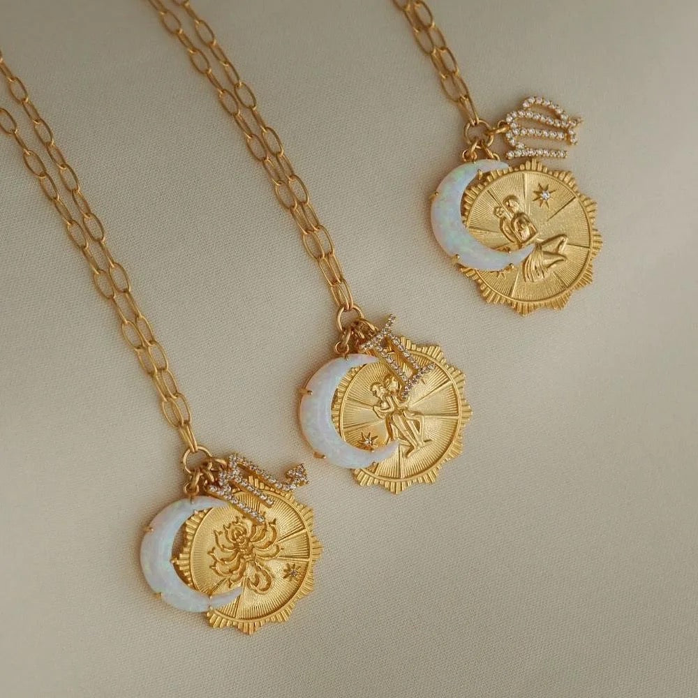 Astrology-themed opal necklace styled in layered look