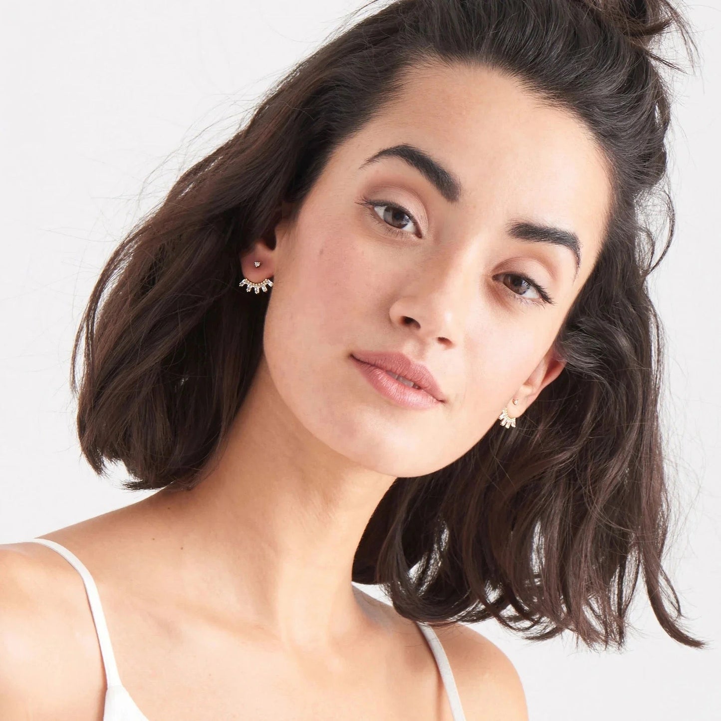 Celebration ear jacket earrings worn with elegant outfit