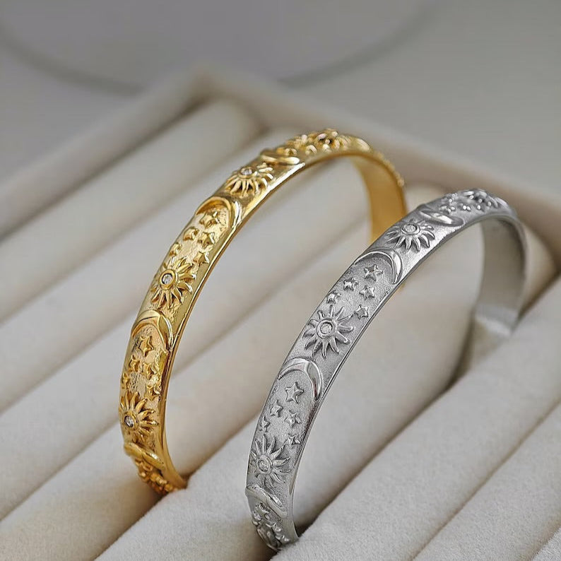 Close-up of celestial bangle bracelet design