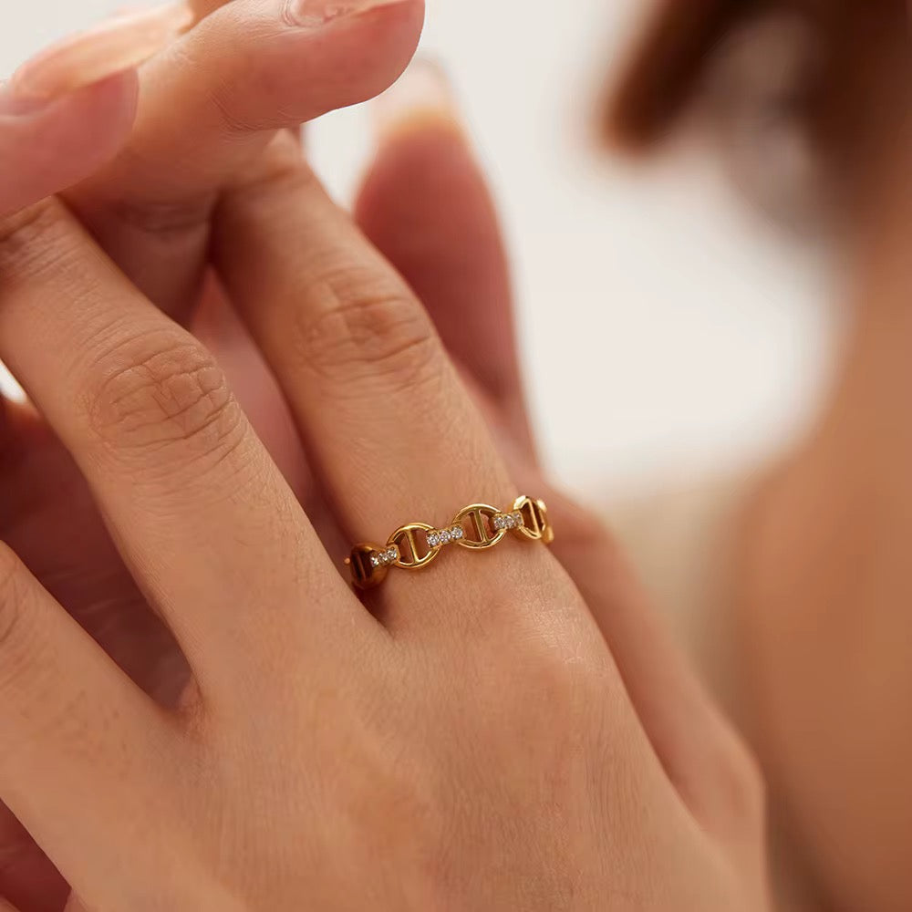 Chain link ring styled with other luxury rings
