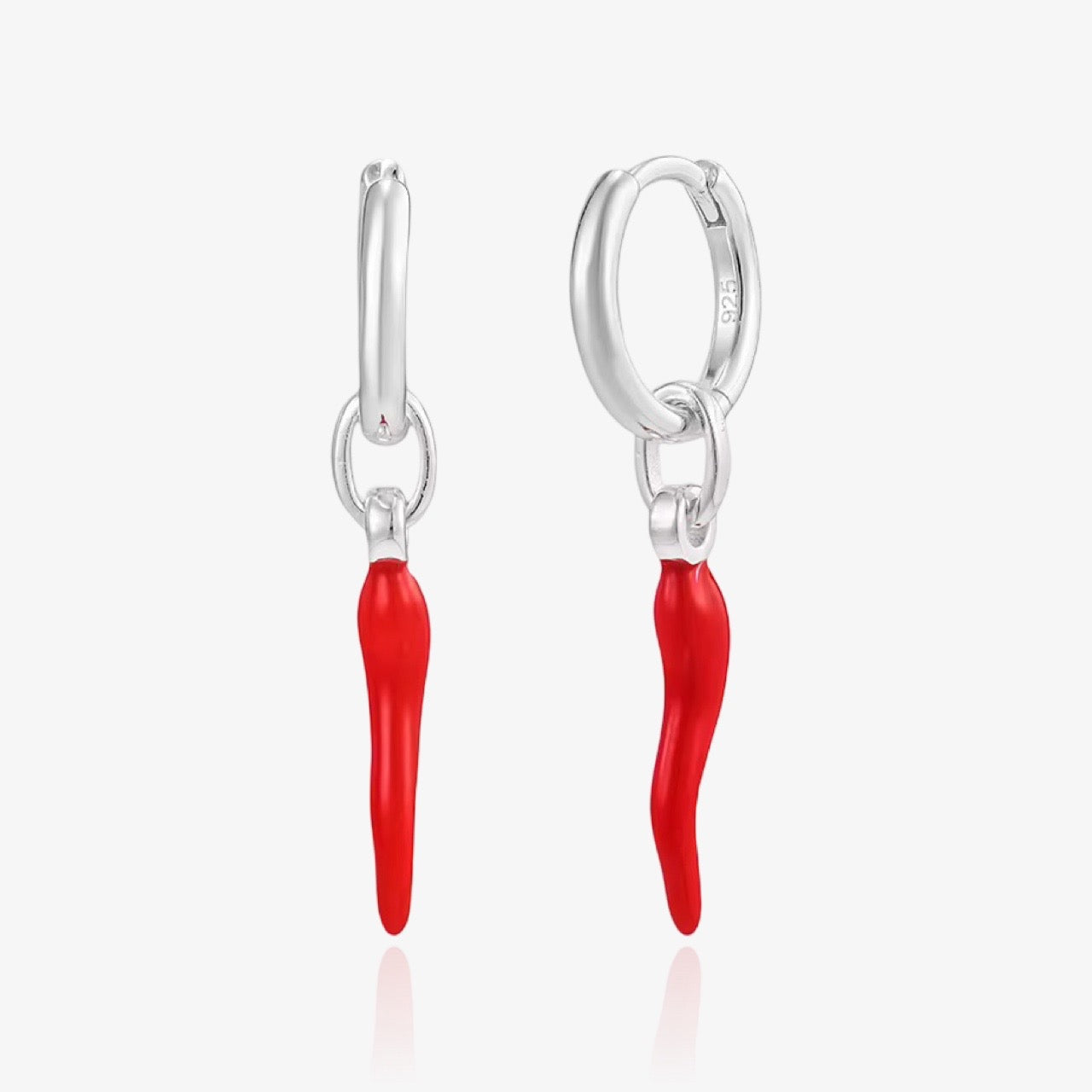Side view of chili pepper earrings in gold and silver