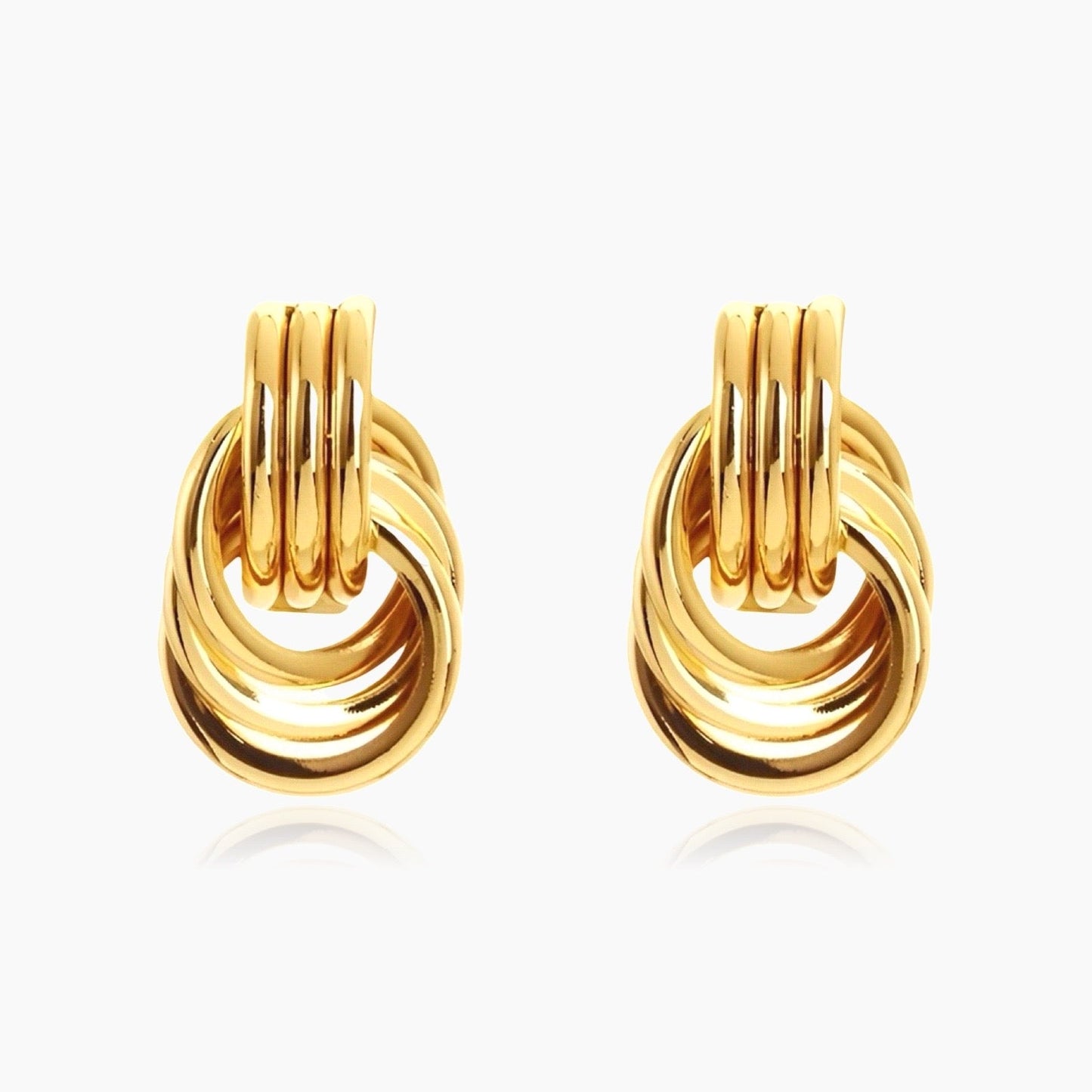 Front view of Clean Knot gold and silver geometric earrings