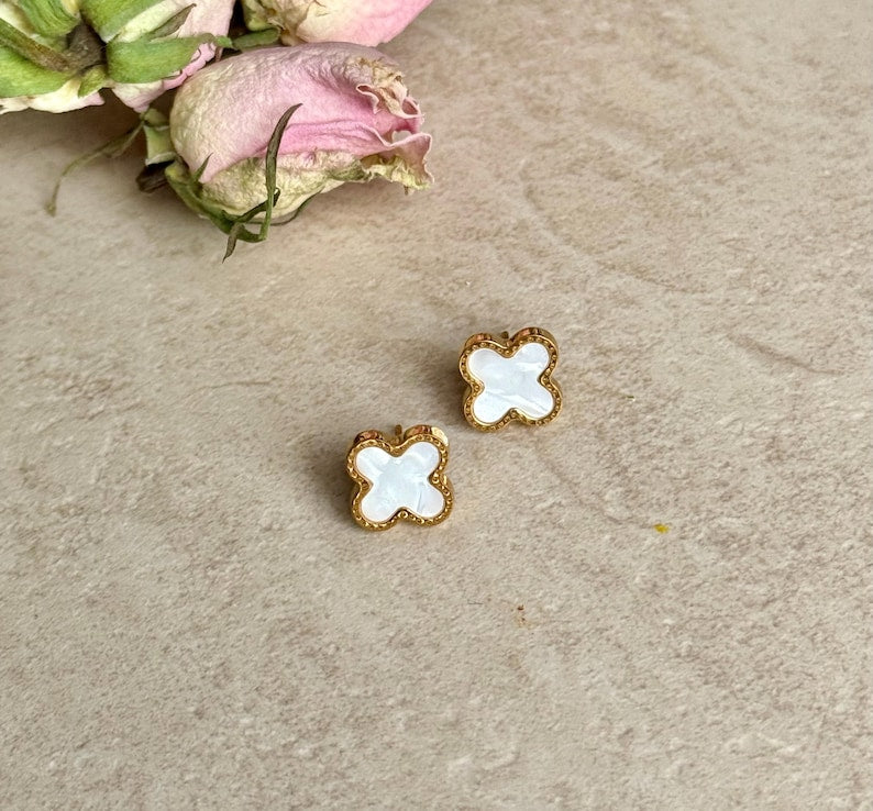 Dainty clover stud earrings styled with casual outfit