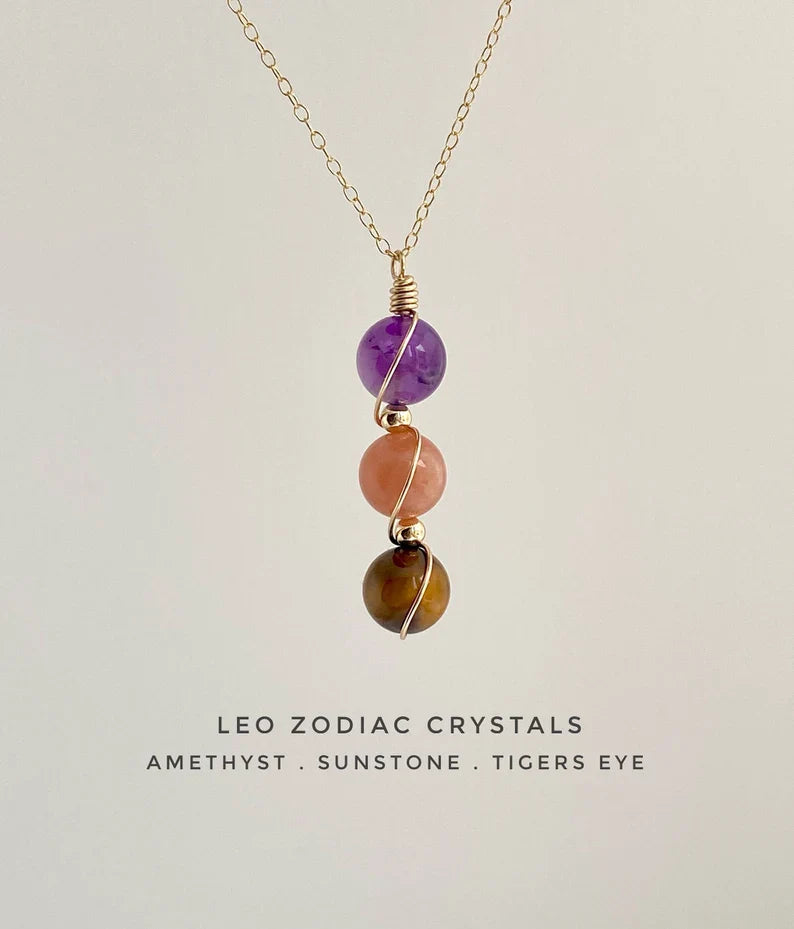 Raw crystal zodiac necklace layered with other chains