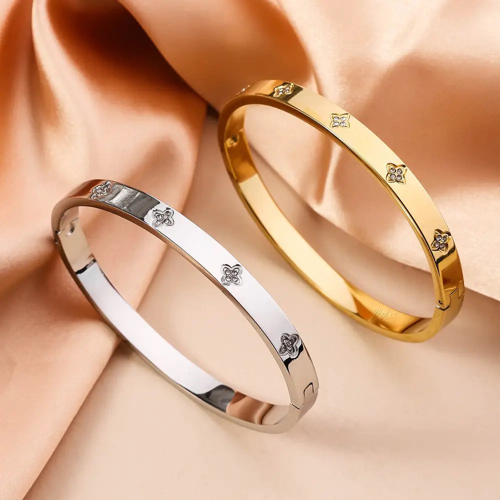 Star bangle bracelet styled with other jewelry