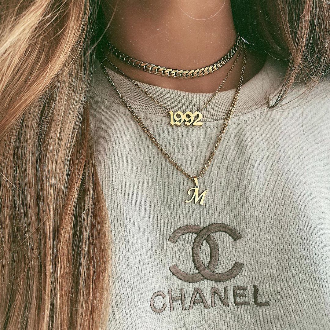 Custom year necklace worn on neckline – retro style