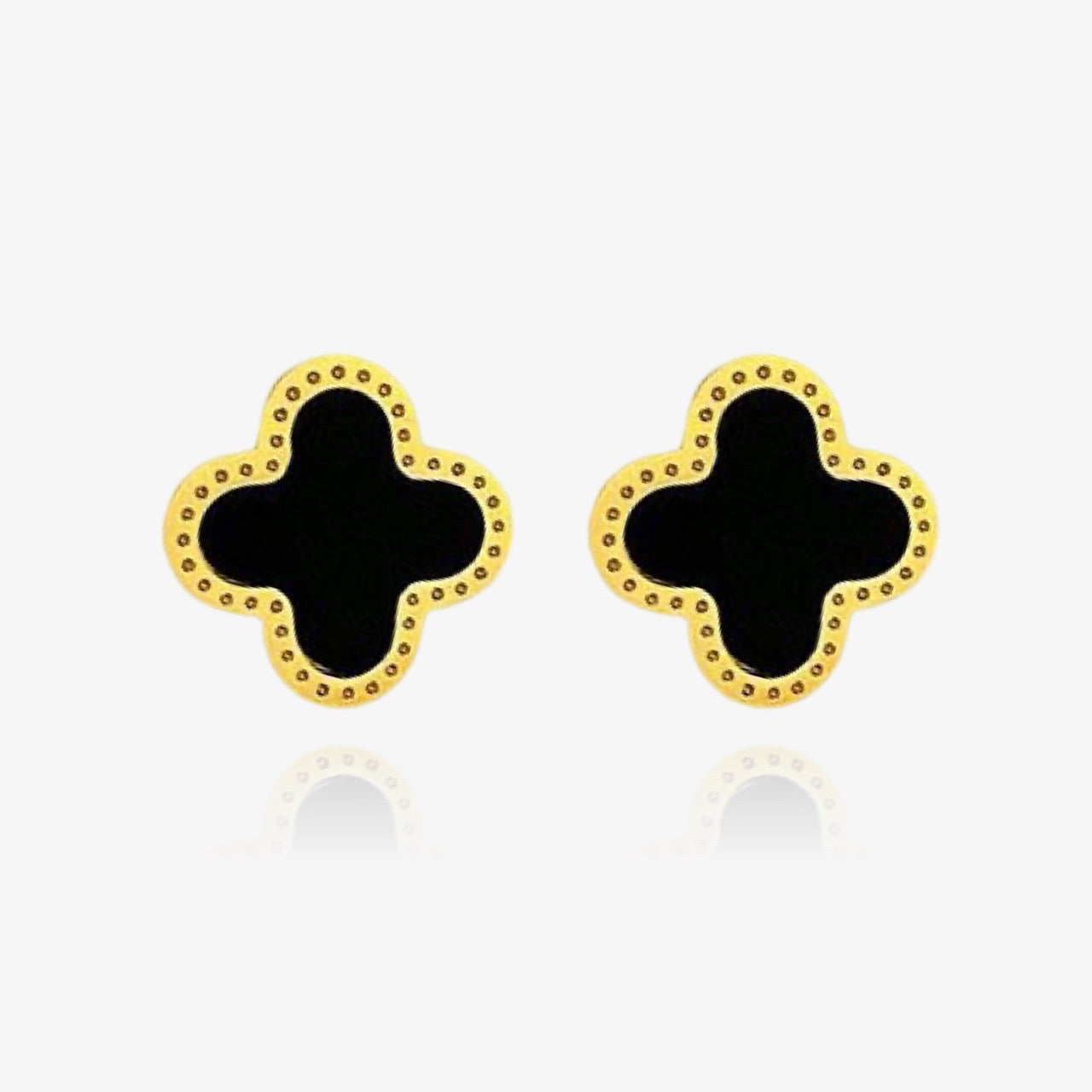 Front view of black clover stud earrings in gold and silver