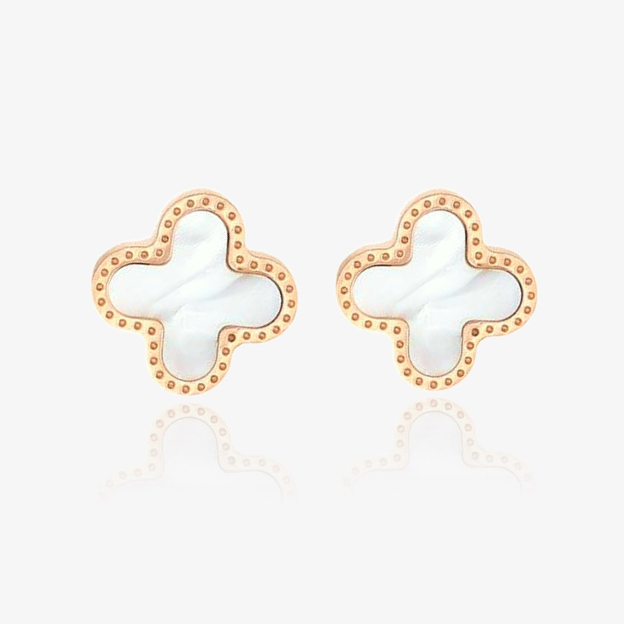 Front view of white clover stud earrings in gold and silver