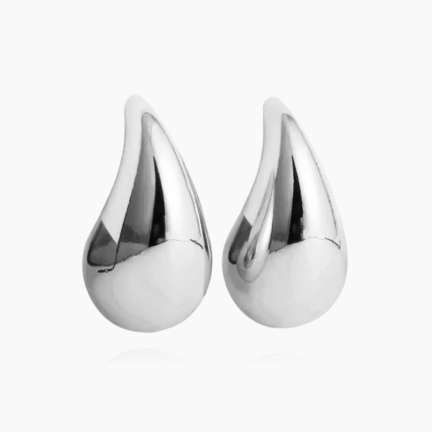 Droplet earrings worn on ear – minimalist look