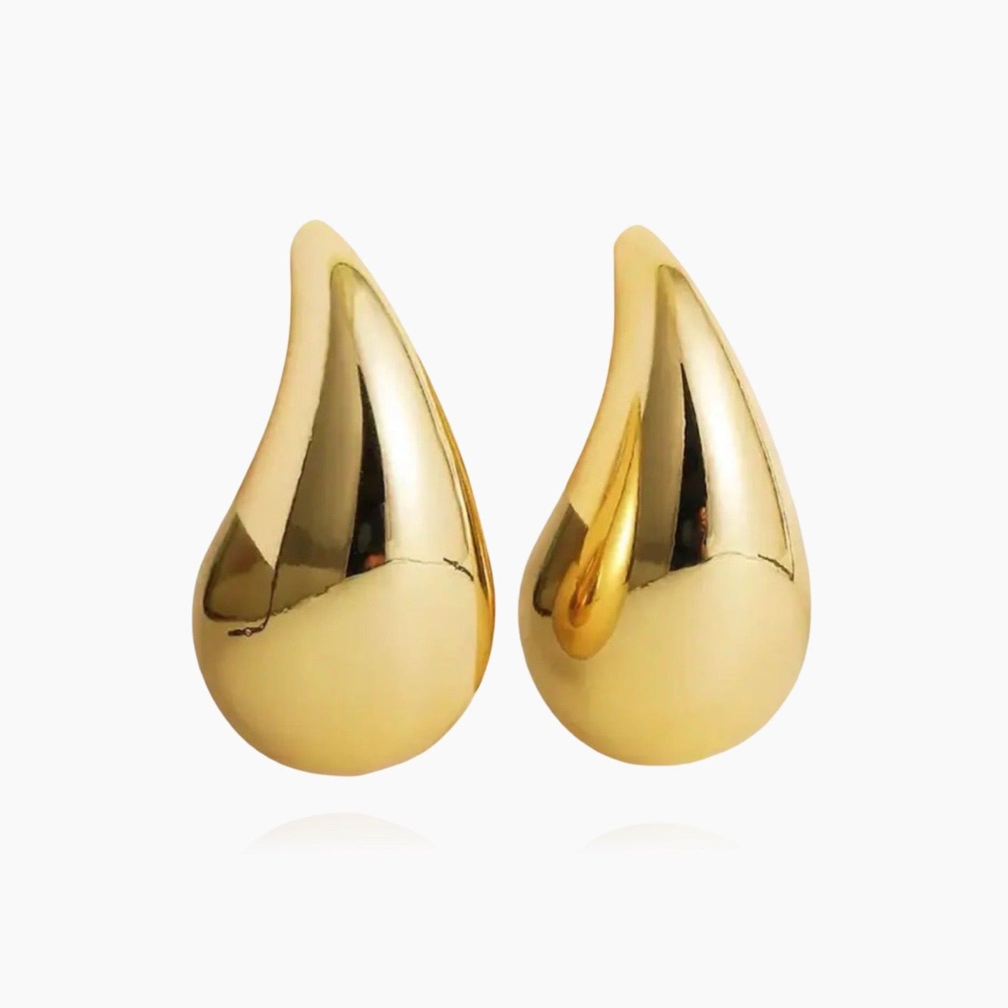 Droplet hoop earrings in gold and silver – front view