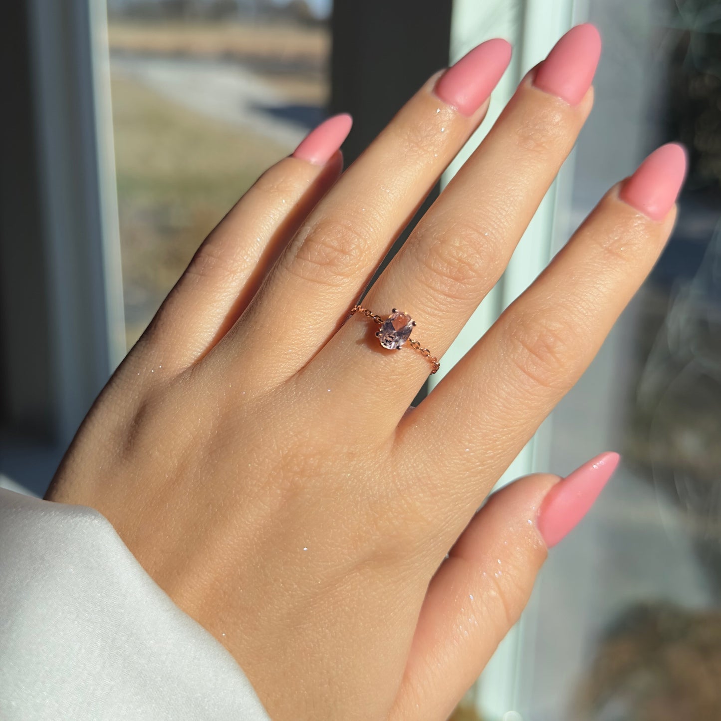 Adjustable chain ring with dusty pink cubic zirconia