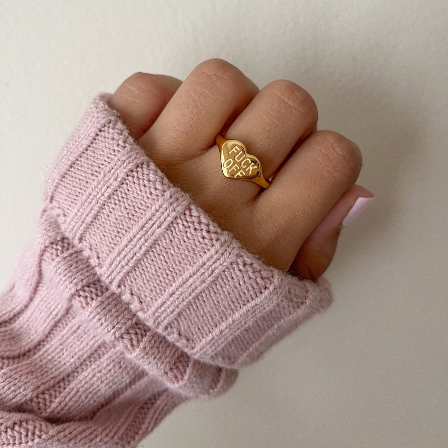Fck Off ring styled on hand with bold look