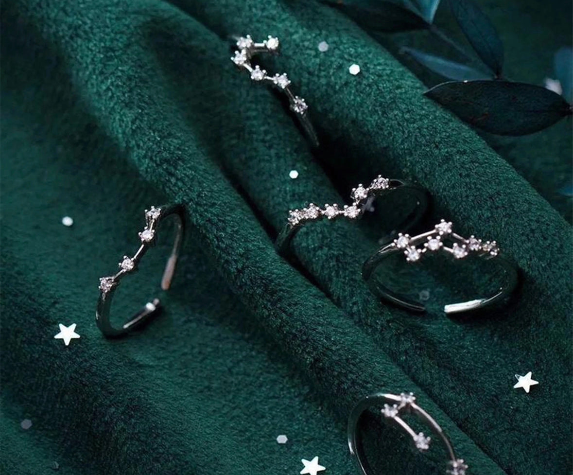 Flatlay of gold Constellation Zodiac Ring