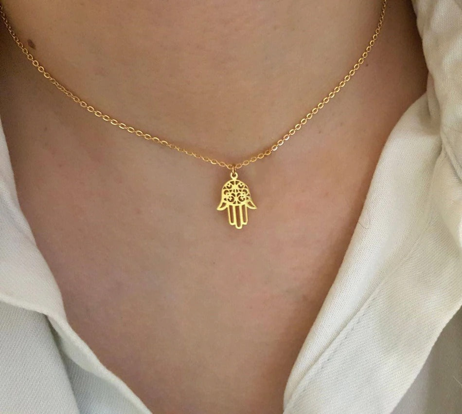 Hamsa Hand necklace layered with other pendants
