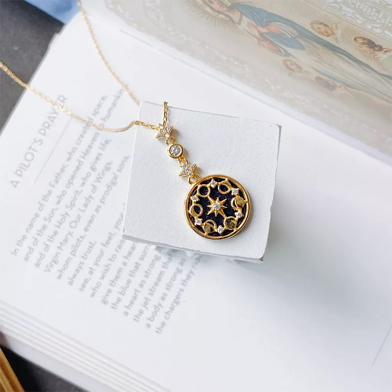 Lunar gemstone necklace styled with elegant outfit