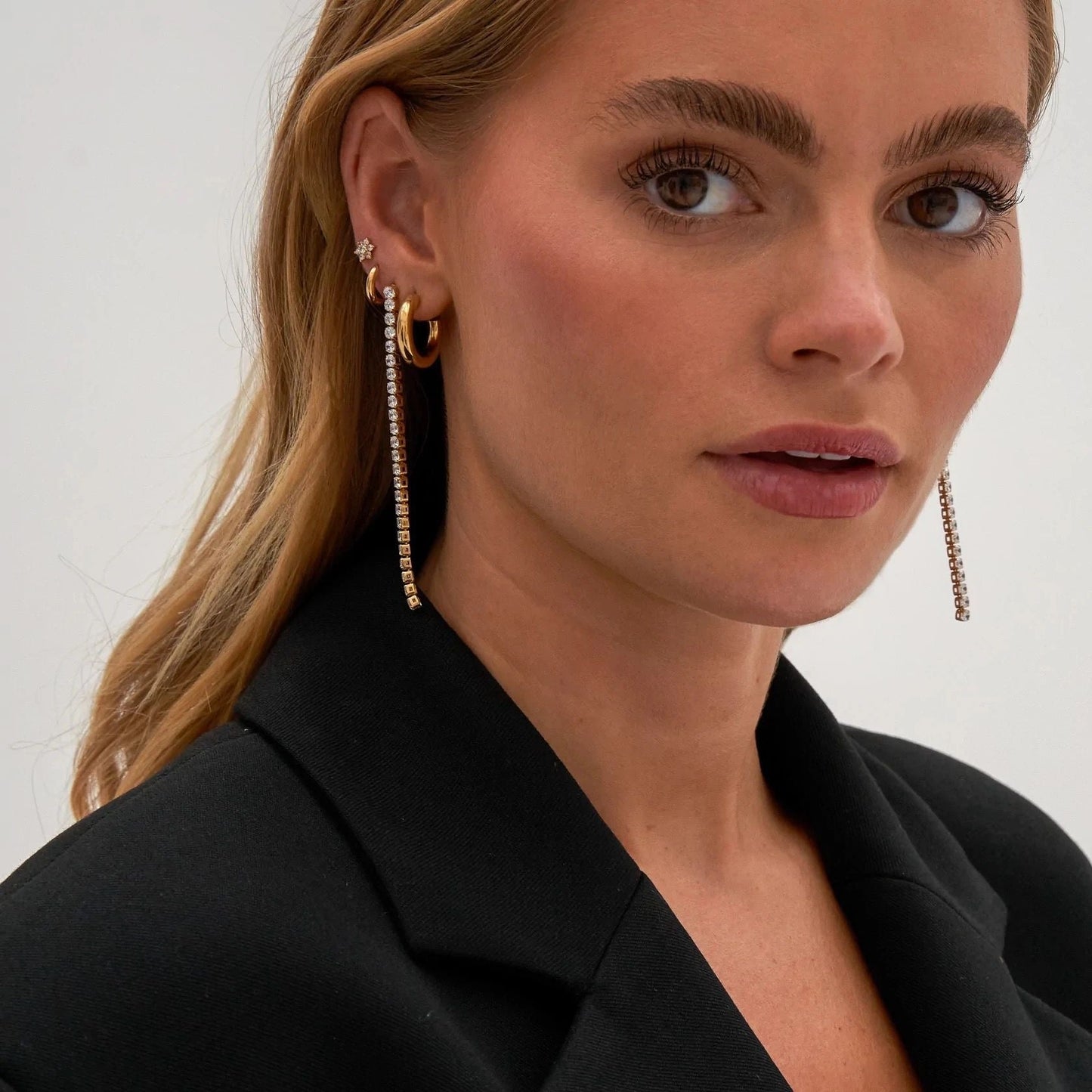 Front view of Luxe crystal string statement earrings