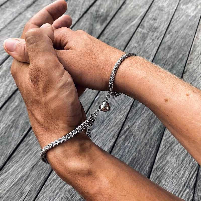 Matching magnetic bracelets styled as a couple's set