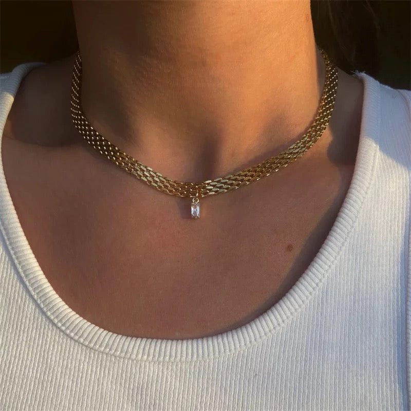 Marilyn necklace layered with other dainty chains