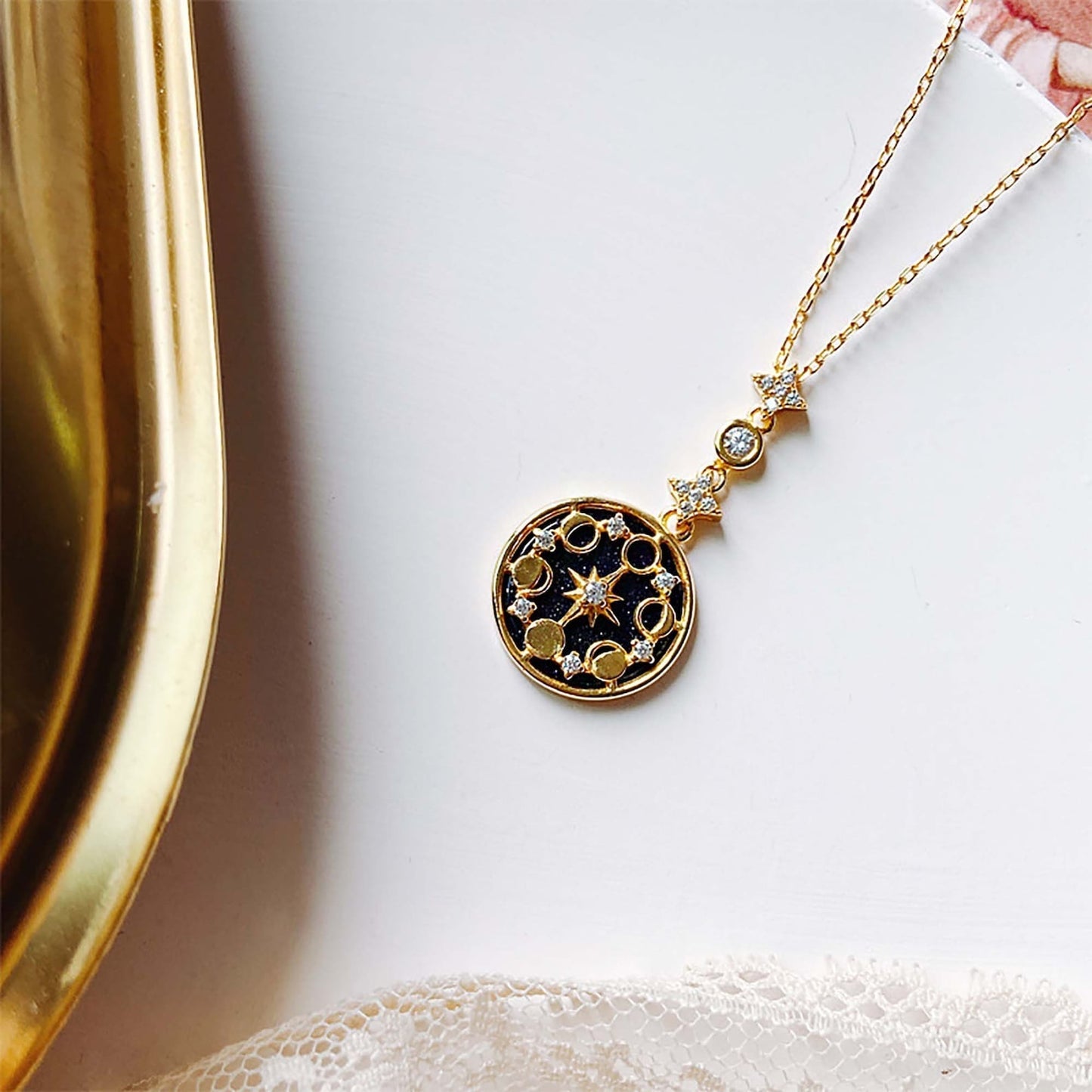 Moon Phase Necklace layered with other gold pieces