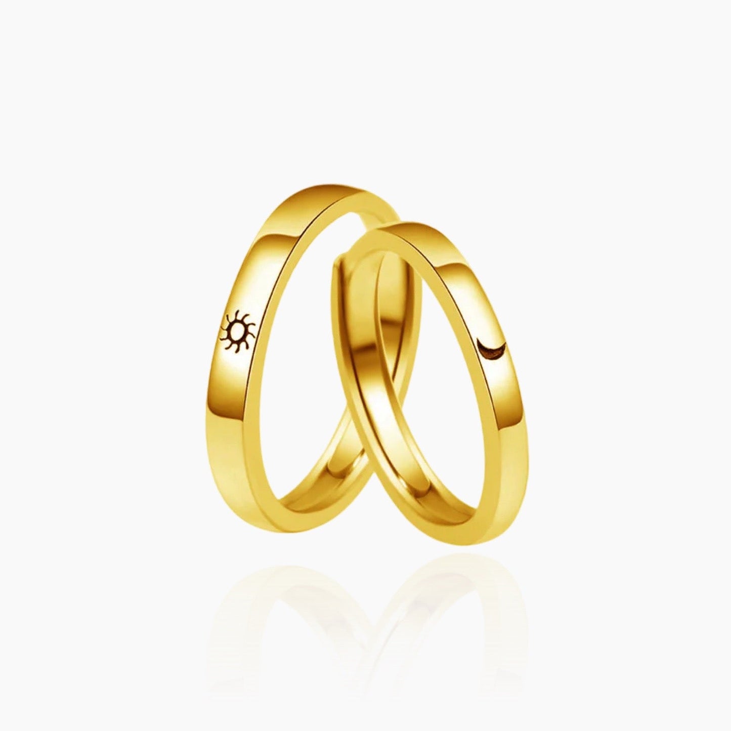 Close-up of Moon and Sun symbols engraved on rings