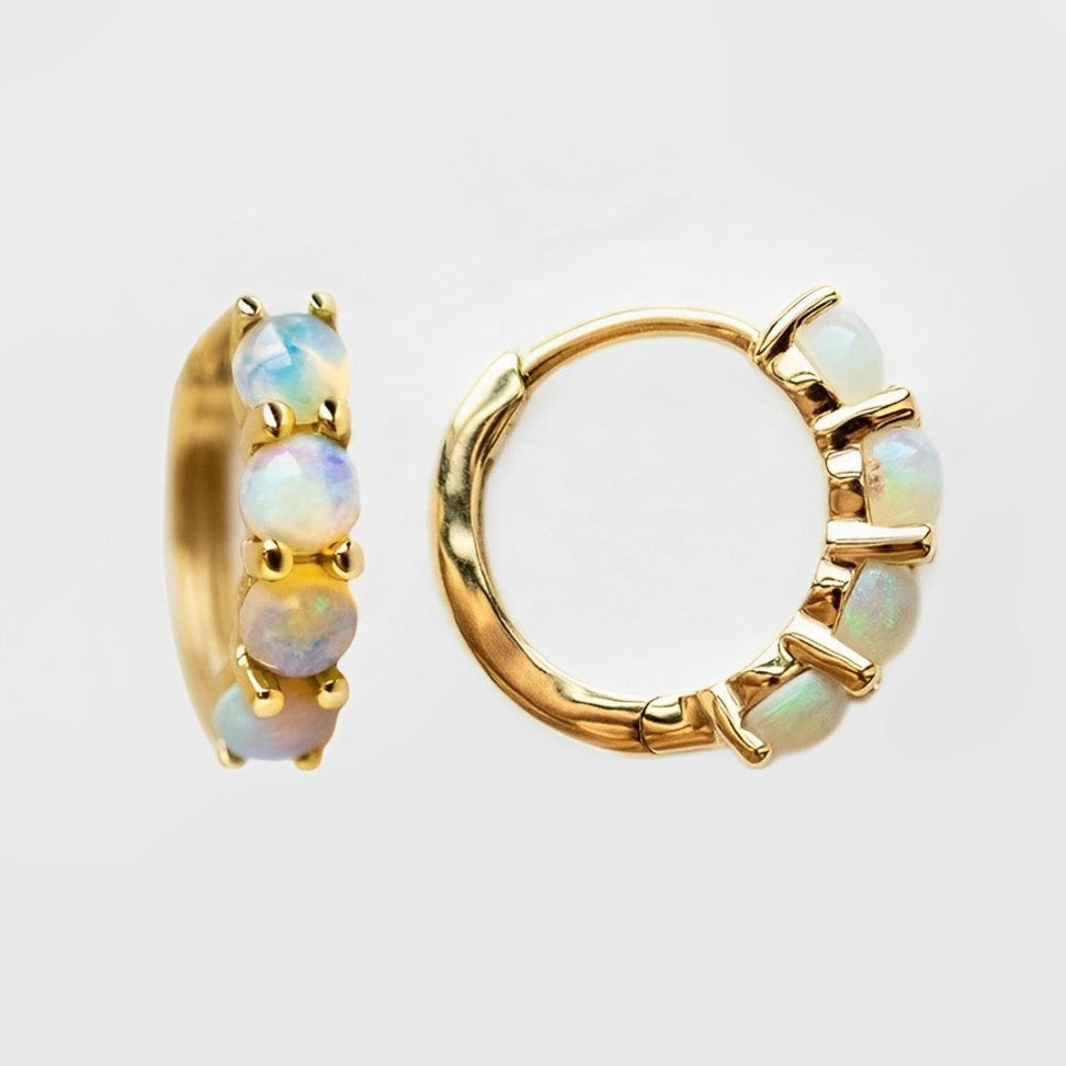 Close-up of opal gemstone set in 925 silver hoop