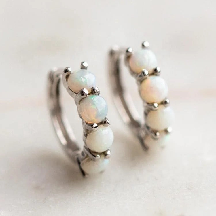 Model wearing opal hoop earrings – spiritual and chic