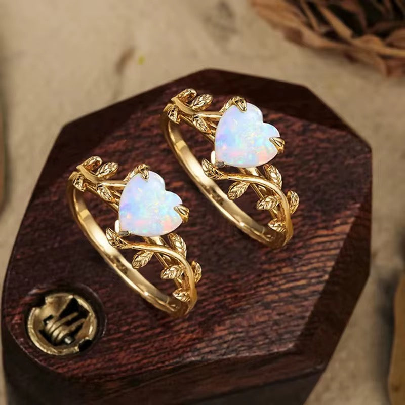 Adjustable opal love ring worn on finger