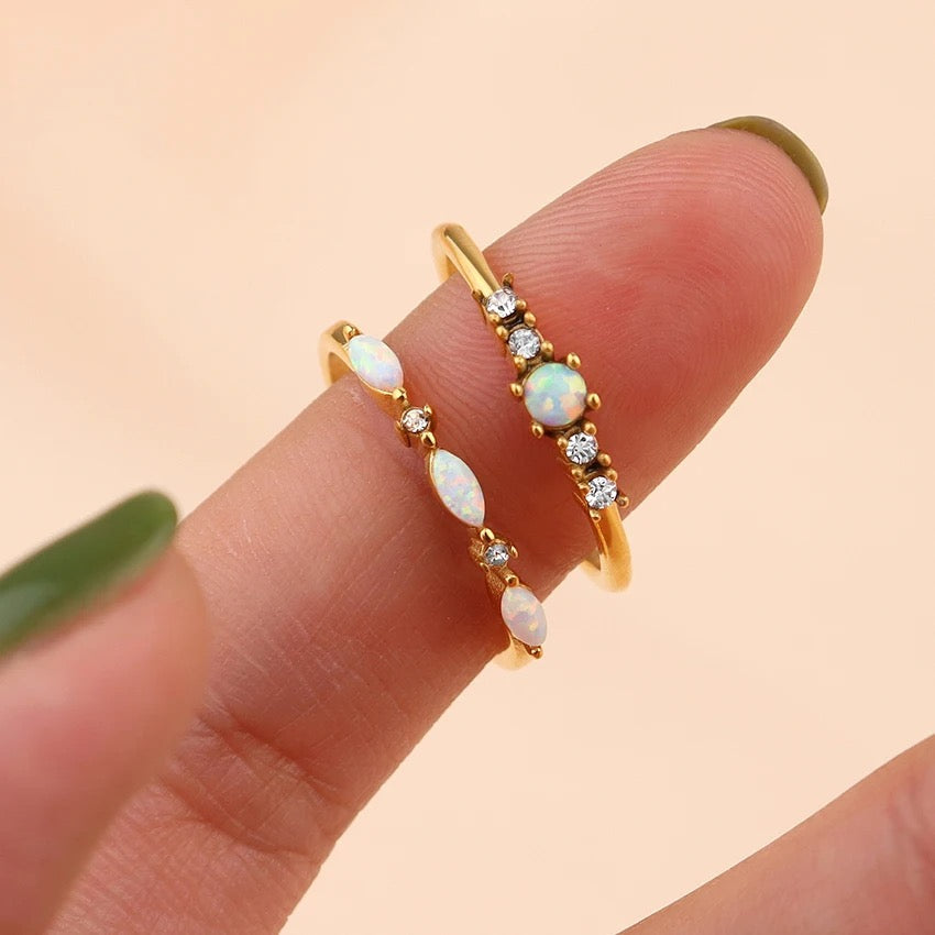 Opal ring shown during elegant hand movement