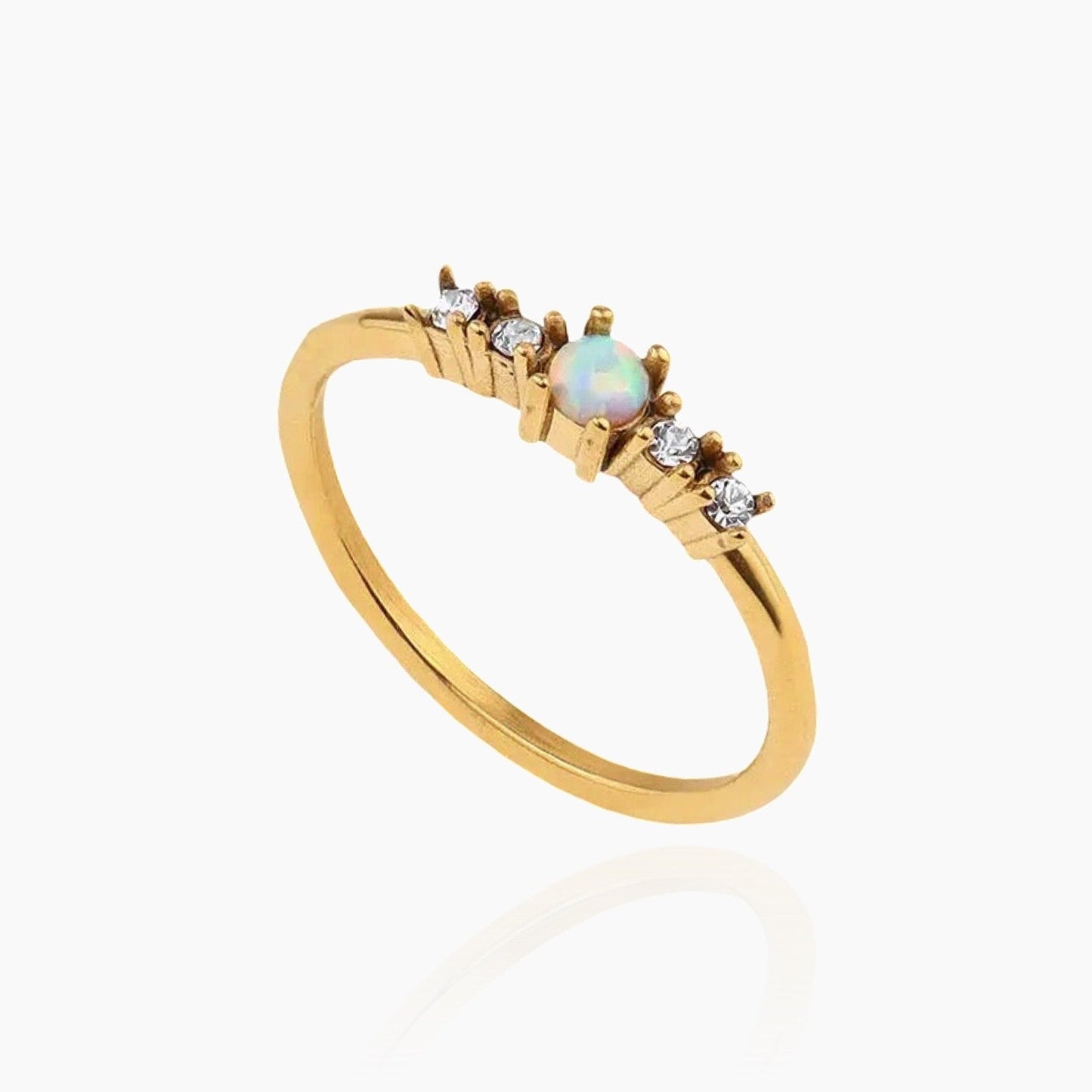 Opal ring with golden glow under warm lighting