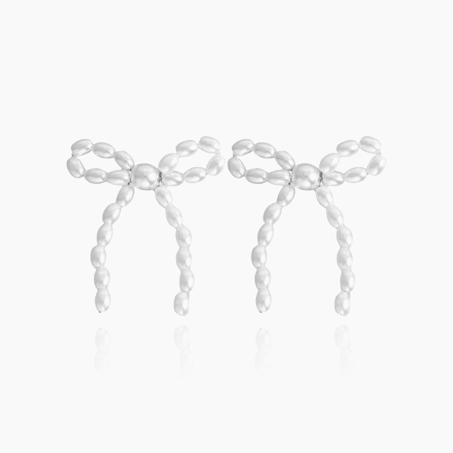 Pearl bow tie earrings in elegant front view