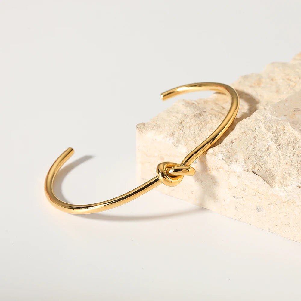 Polished knot bracelet worn on wrist