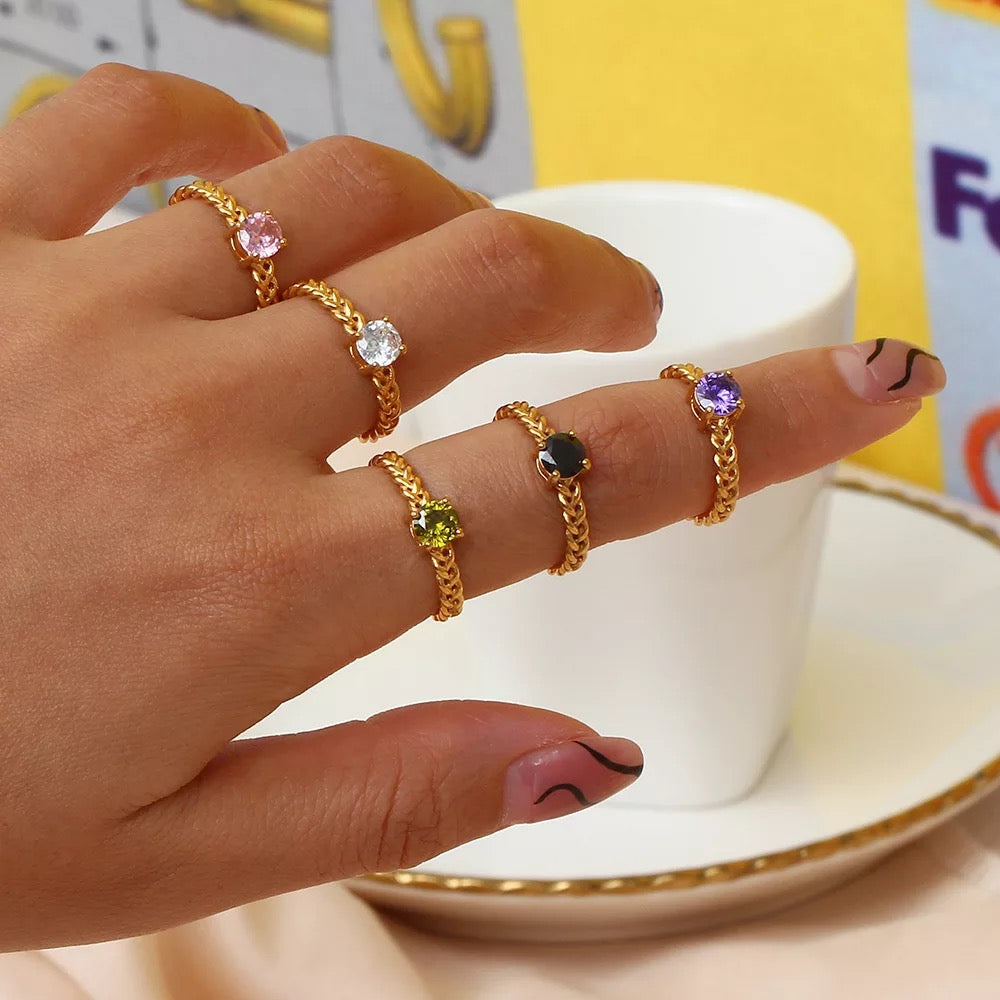 Romy ring reflecting light while worn on hand