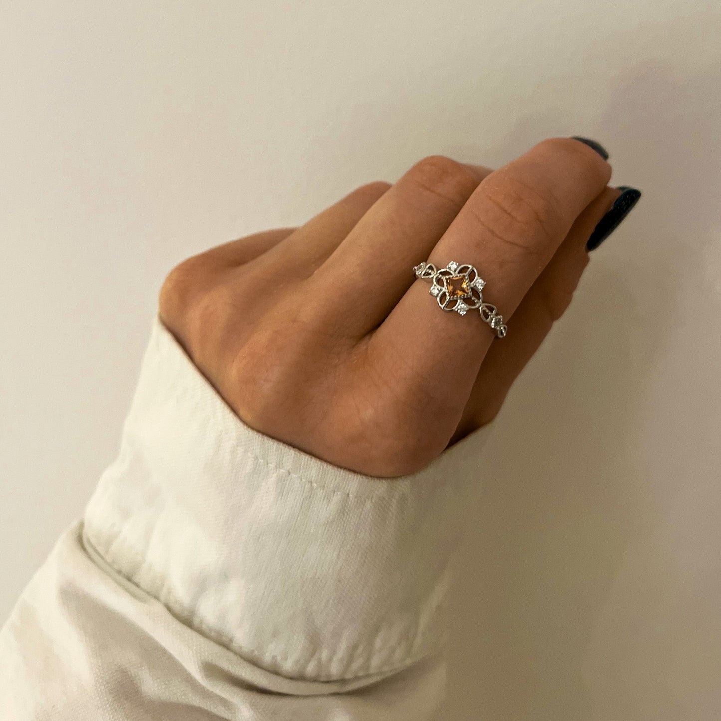 Royal Ring styled on hand showing adjustable design