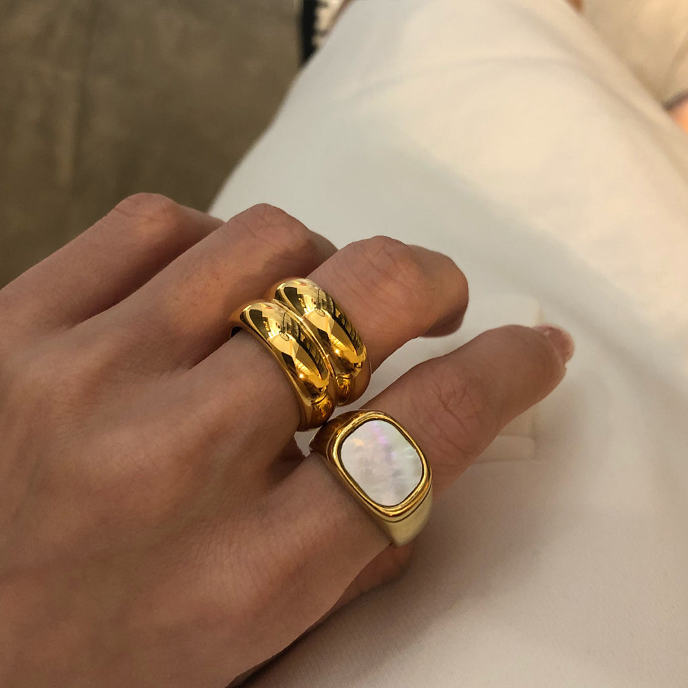Shell gold ring styled with other rings