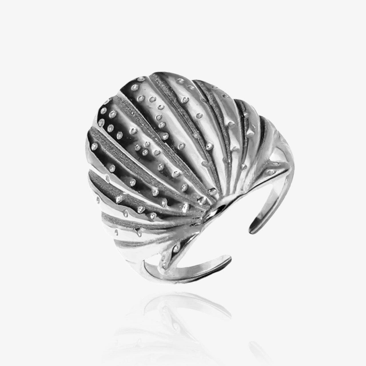 Shell ring styled with stacking summer rings