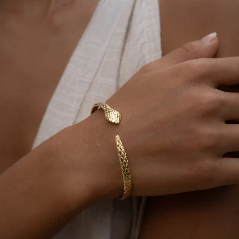 Snake bracelet styled on forearm – bold look