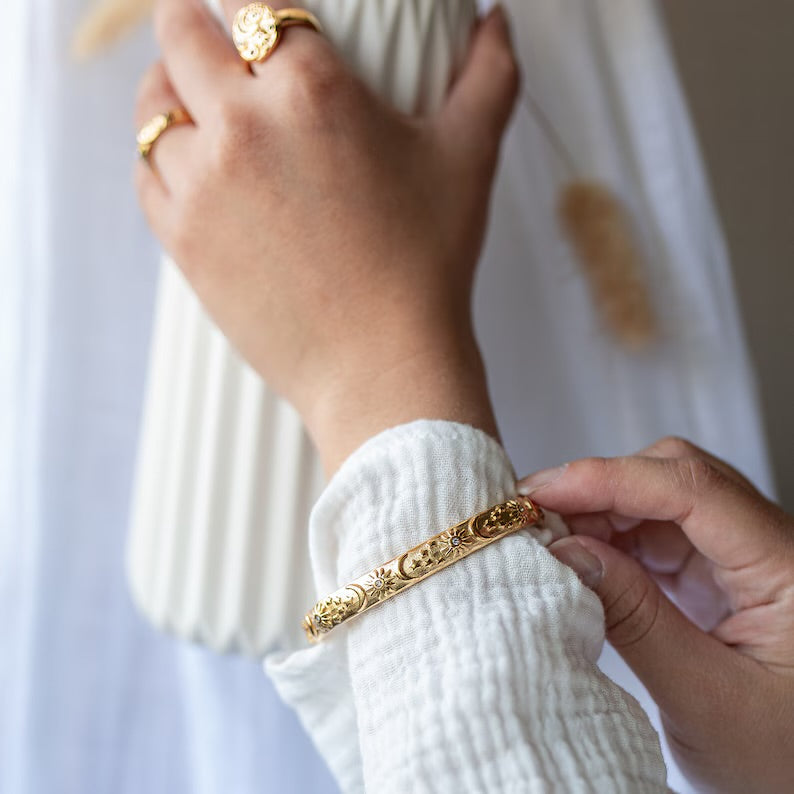 Stacking bangles with celestial design – styled look