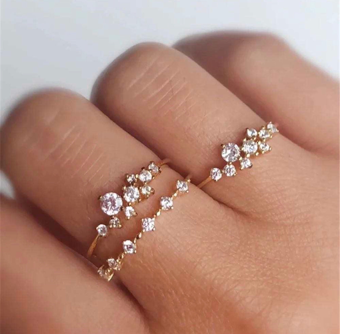 Stardust ring worn on hand under soft night light