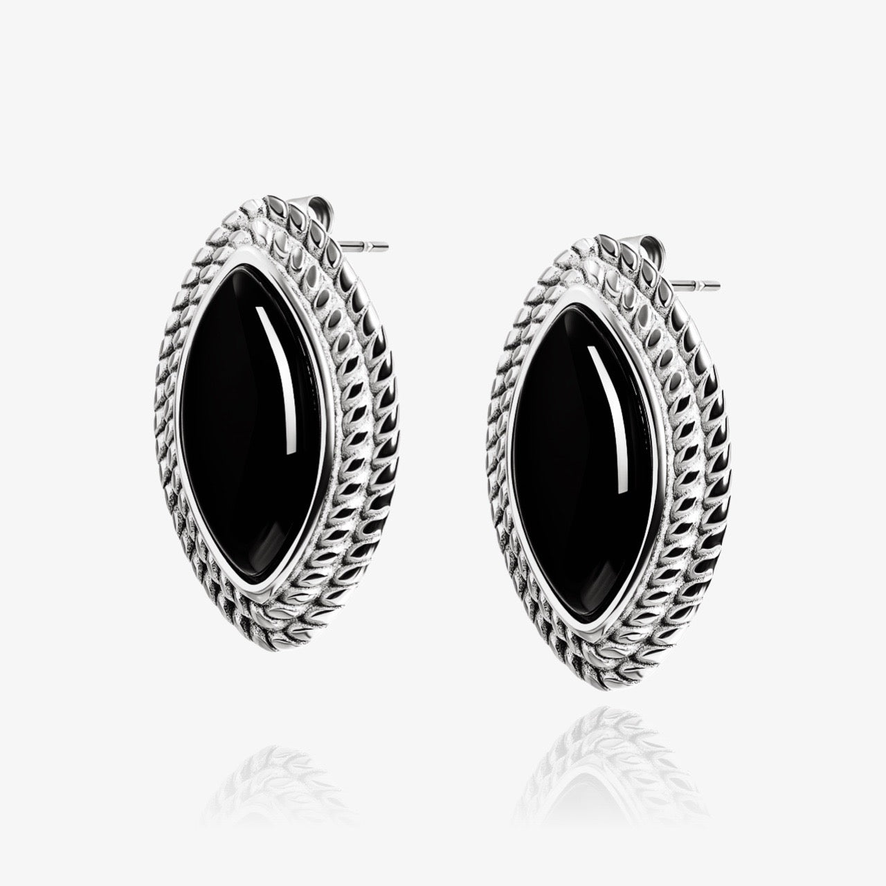 Detail of leaf-shaped Boss Babe earrings