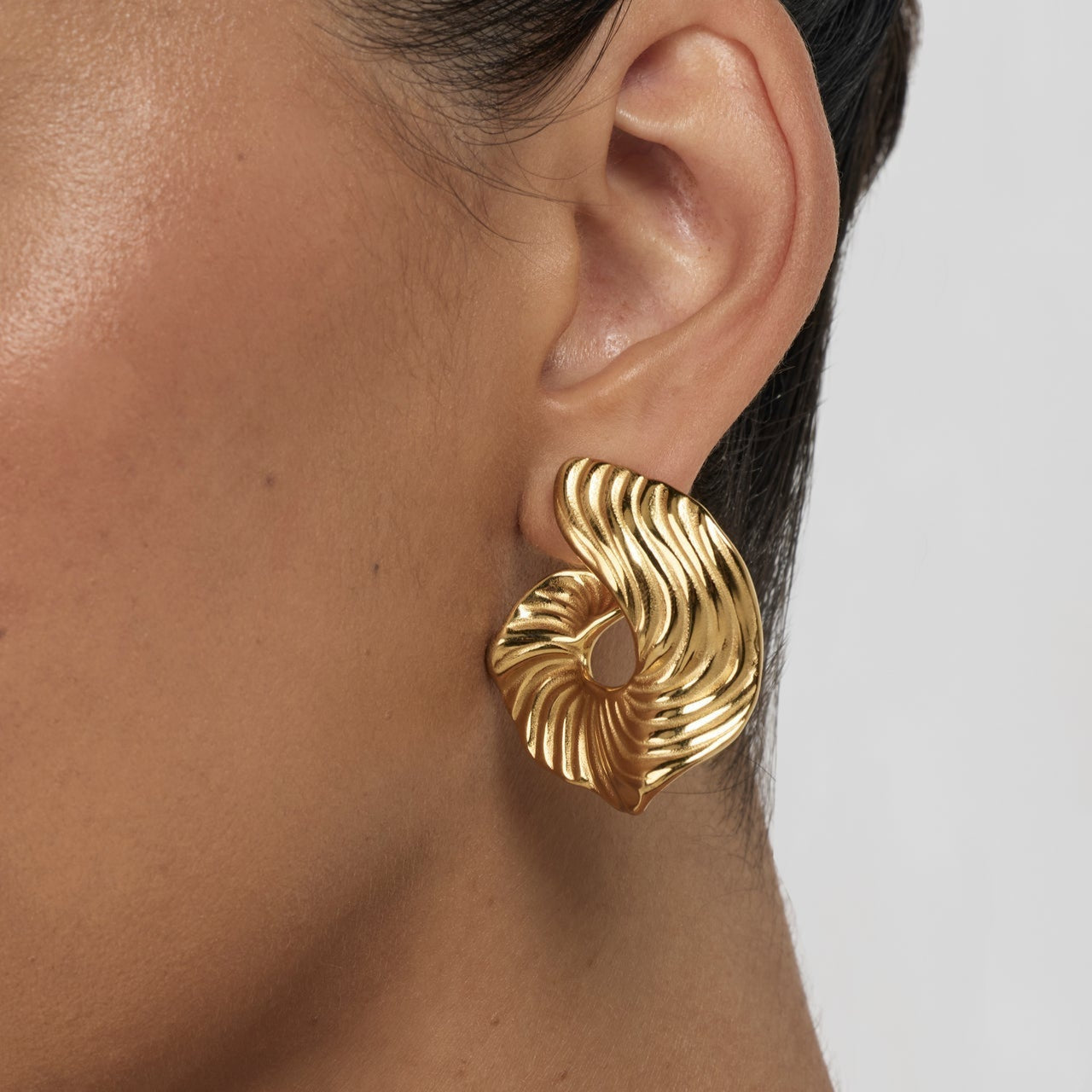 Model wearing Swirl Wave Statement Earrings