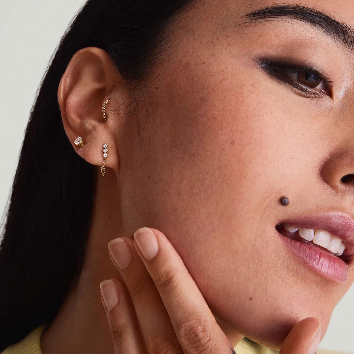 Transformer chain earring worn with asymmetrical look