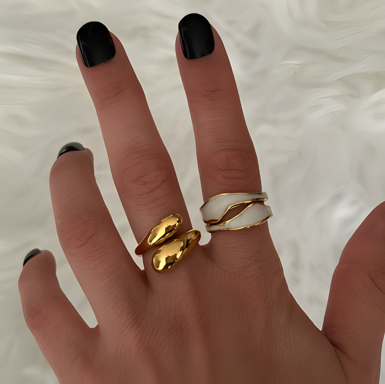 Double twist ring styled with other stackable rings