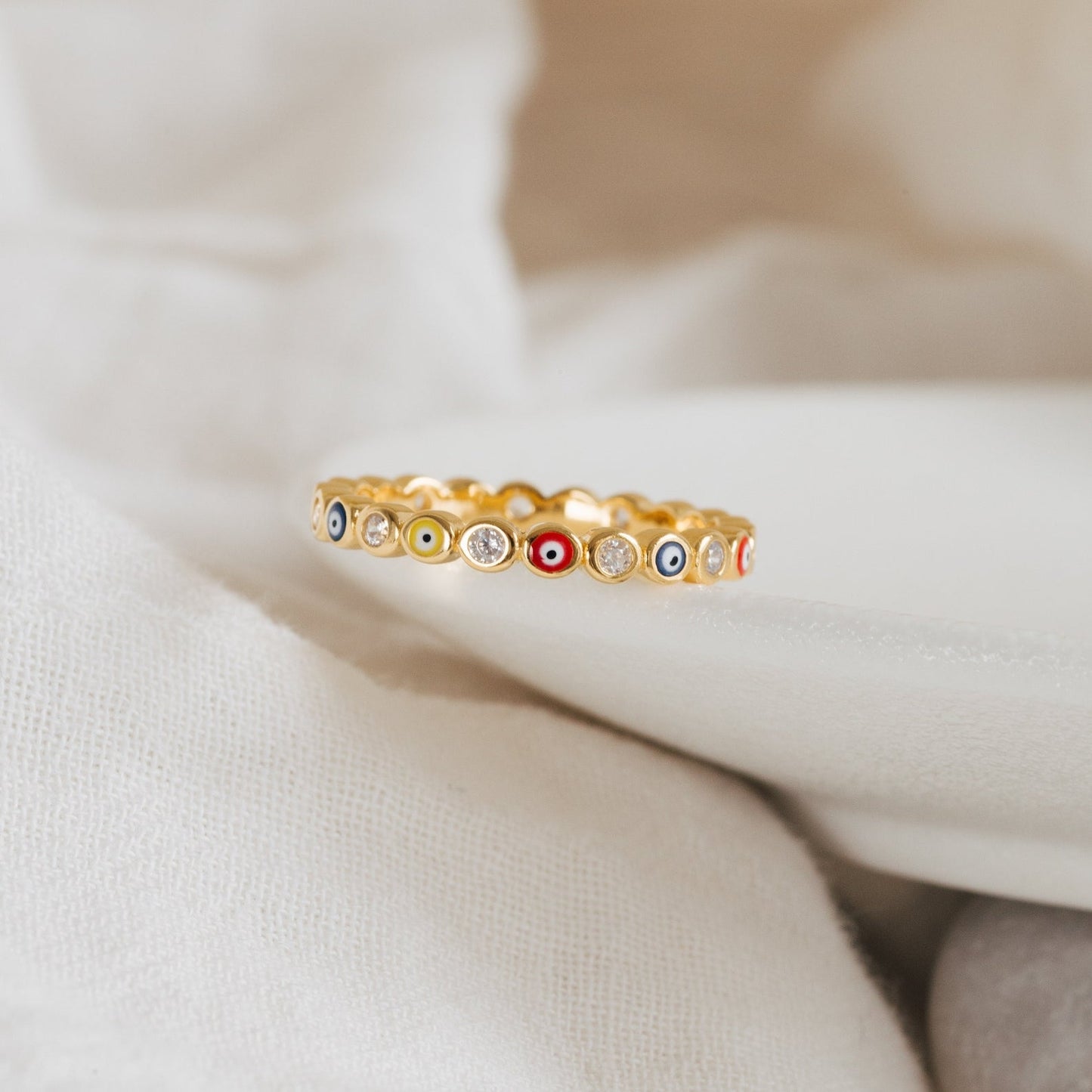 Evil Eye ring stacked with other gold rings