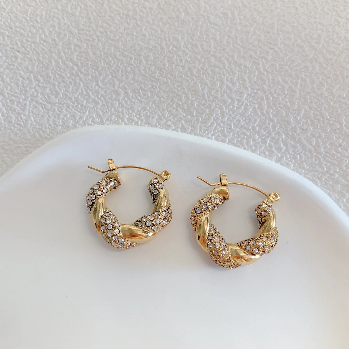 MADDIE green crystal hoops shown in waterproof test
