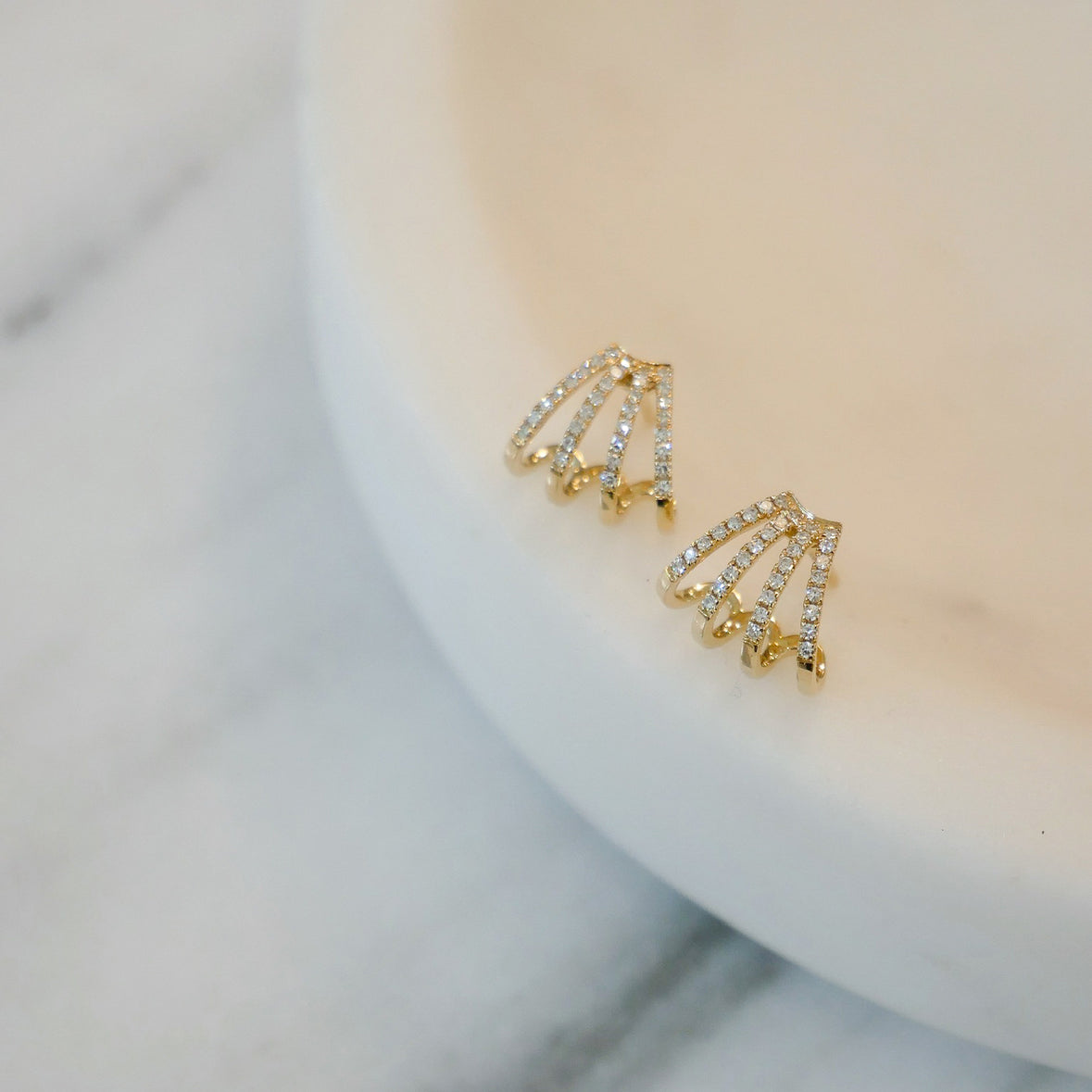 Waterproof test of multi hoop earrings in gold finish