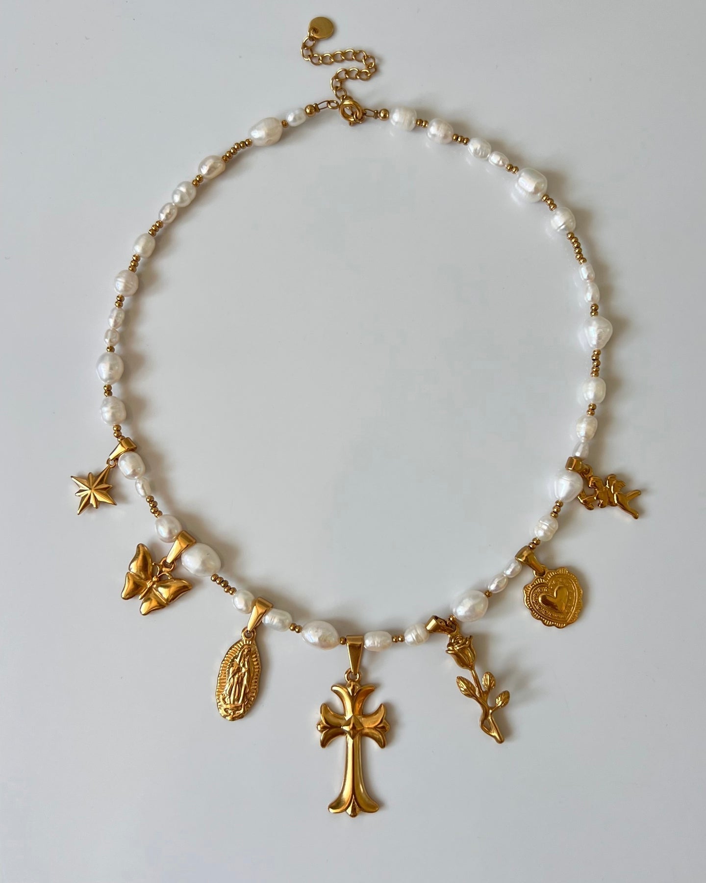 Detail of waterproof pearls and charms necklace