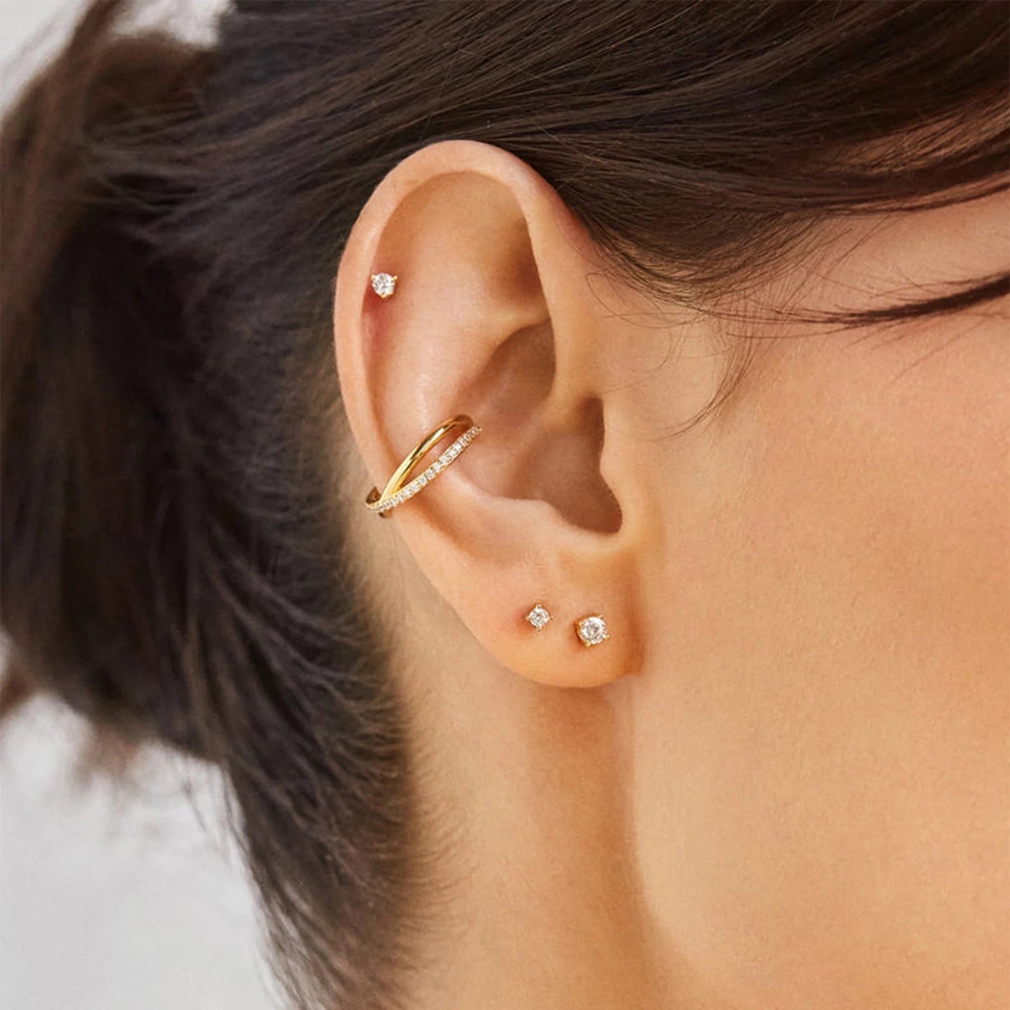 Close-up of pave crystals on X-shaped ear cuff
